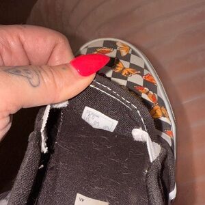 Vans Black and White Checkered Sneakers with Orange Butterflies